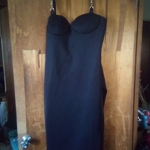 Long black dress with a spilt in the side gold buckles on the stripeless